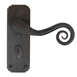 From The Anvil 33902 - Beeswax Unsprung Monkeytail Lever on Bathroom Backplate
